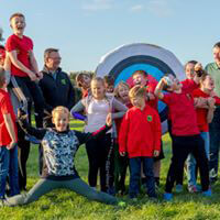 Kids at archery box image